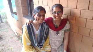 Two women bench brick wall - a bench next free wallpaper