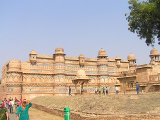 Large building crowd green fire - ambreen butt free wallpaper