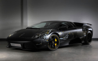 Black sports car yellow wheels 5 - a white wall free wallpaper
