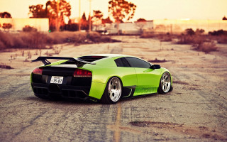 Green sports car desert sunset - a dirt road in the desert free wallpaper