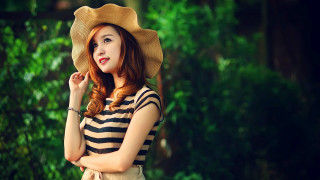Woman hat posing woods hands 2 - her cheek free wallpaper