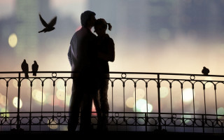 Couple kissing bridge birds flying 2 - free valentines wallpaper