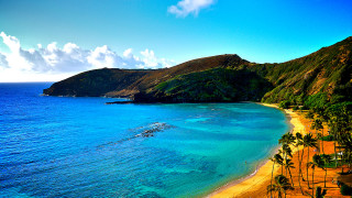 Beach mountain blue water boat - a mountain in the background free wallpaper