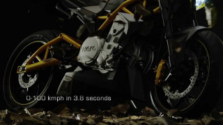 Motorcycle parked leaves dark caption - a caption free wallpaper