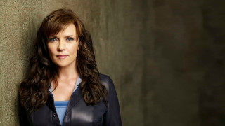 Woman leaning wall eyes closed 2 - a jacket free wallpaper