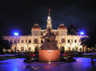 Statue woman building night lights - a clock tower free wallpaper