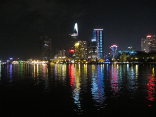 City skyline night lights reflection 6 - the water and a boat free wallpaper