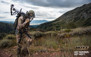 Man bow arrows field mountains - holography free wallpaper