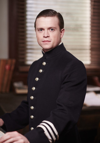 Man uniform sitting desk keyboard - david budd free wallpaper