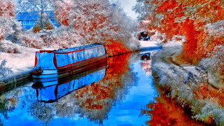 Boat floating fall colors river - a house in the background free wallpaper