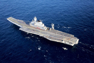 Aircraft carrier ocean plane flying 3 - a plane free wallpaper