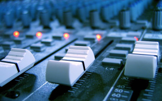Sound board closeup buttons knobs 2 - side and a blurry background free wallpaper