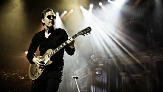 Man playing guitar stage lights - david lazar free wallpaper