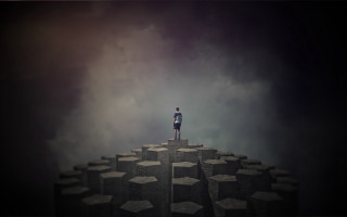 Man standing rock formation sky - daryush shokof free wallpaper