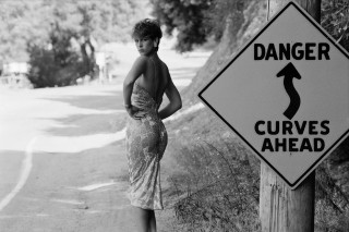 Woman danger curves ahead road - fine art free wallpaper