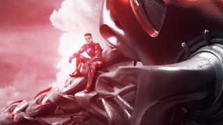 Man sitting giant red object - cloud behind free wallpaper
