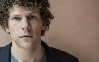 Man curly hair serious look - his face and shoulders free wallpaper