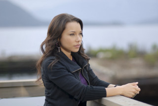 Woman leaning rail lake mountains - a rail free wallpaper
