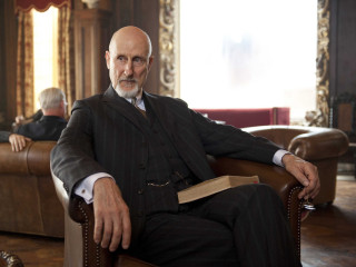 Man sitting chair book lapel - david annand free wallpaper