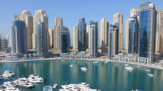 Marina boats city tall buildings 2 - the water and a city in the background free wallpaper