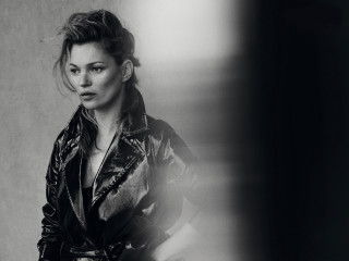 Woman leather jacket posing wall - a wall behind her free wallpaper