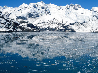 Mountain range reflection lake ice - ice flo free wallpaper