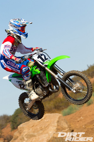 Man riding dirt bike air - lowbrow free wallpaper