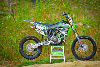 Dirt bike parked platform grass - near free wallpaper