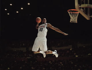 Man jumping dunk basketball stadium 3 - a crowd watching free wallpaper