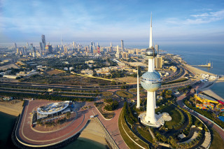 City clock tower waterfront panorama - a large body of water free wallpaper