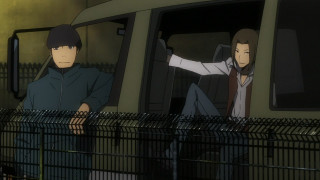 Two people train station fence - one person free wallpaper