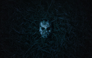 Mask laying grass dark night - a white mask free wallpaper