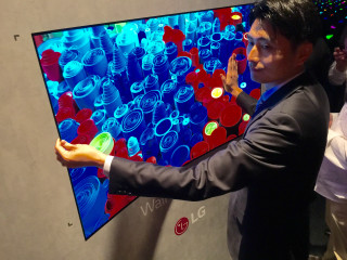 Man suit holding screens interactive - interactive free wallpaper