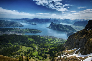 Mountain lake snowy background view - a view of a mountain range free wallpaper