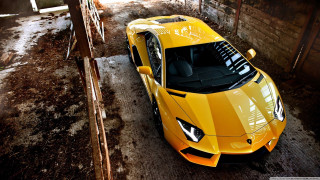 Yellow sports car garage building - a window open free wallpaper