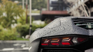 Black sports car rainy day - tail free wallpaper
