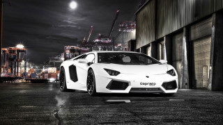 White sports car night cityscape 4 - a city skyline in the background free wallpaper