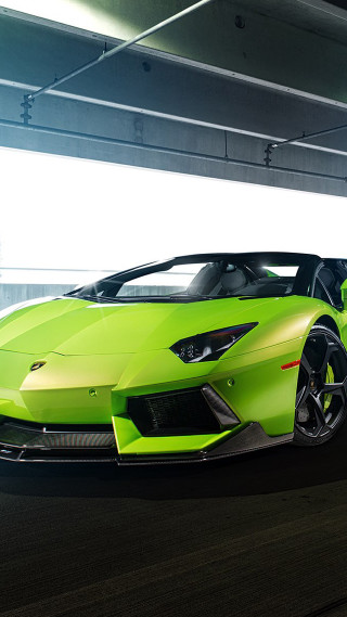Green sports car street parking - the side of the road free wallpaper