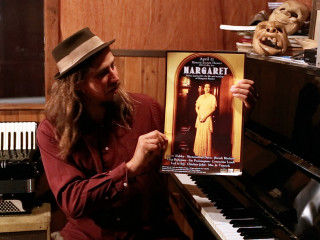 Man holding poster piano top - barbizon school free wallpaper