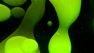Green liquid flowing black surface - a black surface free wallpaper