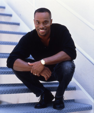 Man smiling stairs hands knees - derold page free wallpaper