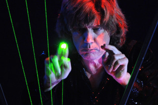 Man holding green light pointing - his hand free wallpaper