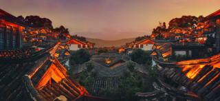 City night view buildings lights - a mountain in the distance free wallpaper