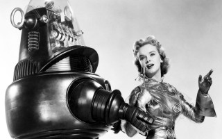Futuristic suit woman robot arm - a hand free wallpaper