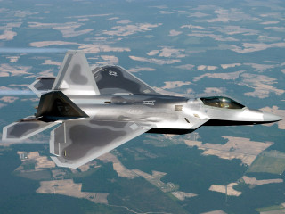 Jet flying lush green field - a jet free wallpaper