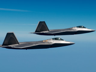 Two jets flying blue sky - a blue sky background free wallpaper