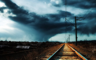 Train track dark clouds telephone - stormy weather free wallpaper