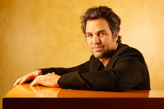 Man sitting smiling table facial - brad holland free wallpaper