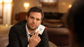 Man holding card sitting looking - the camera man free wallpaper