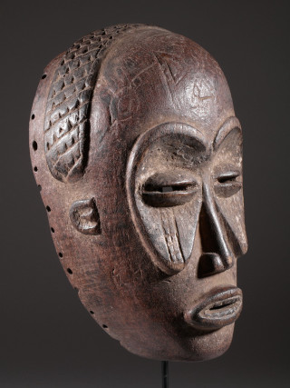 Wooden mask metal parts stand - a face free wallpaper